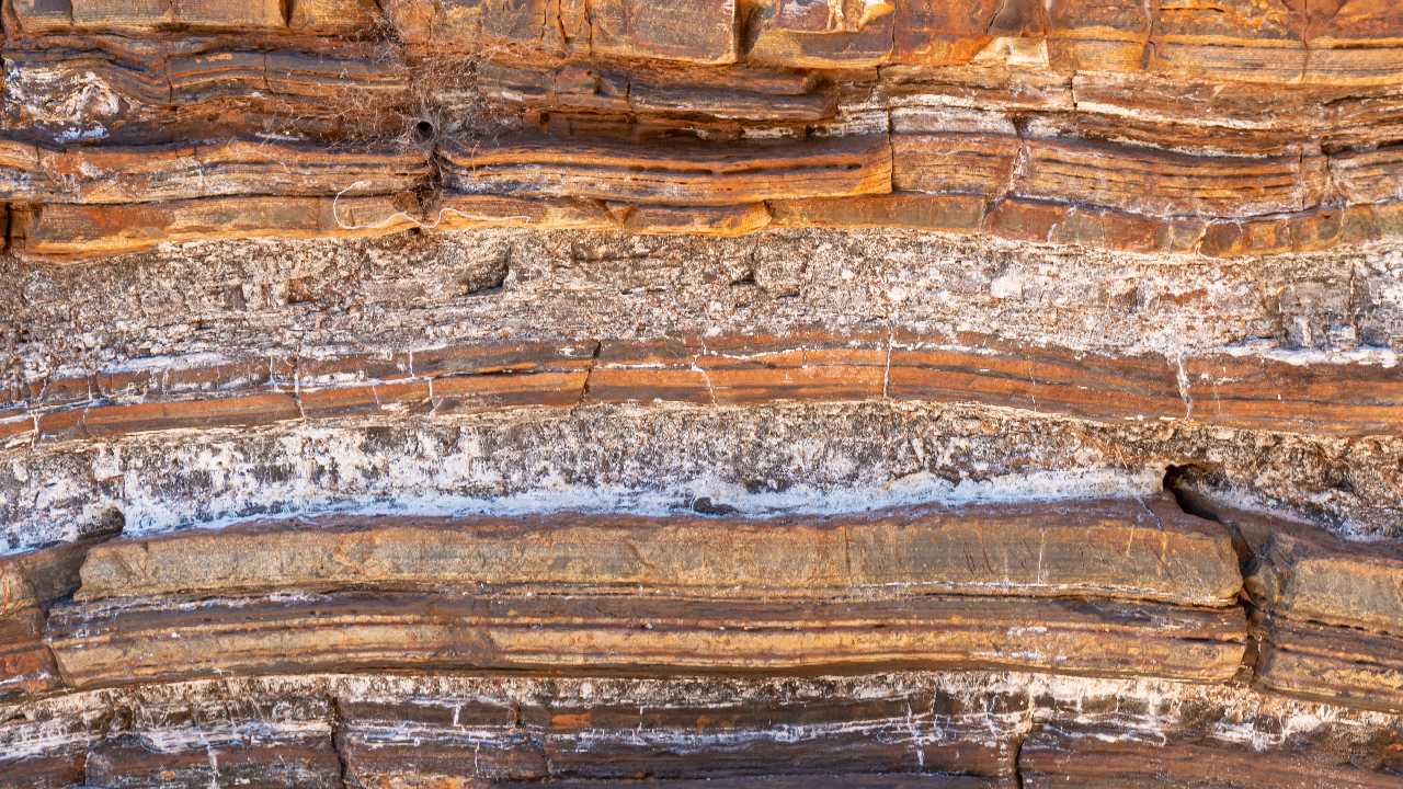 Asbestos fibres naturally occurring in a rock face