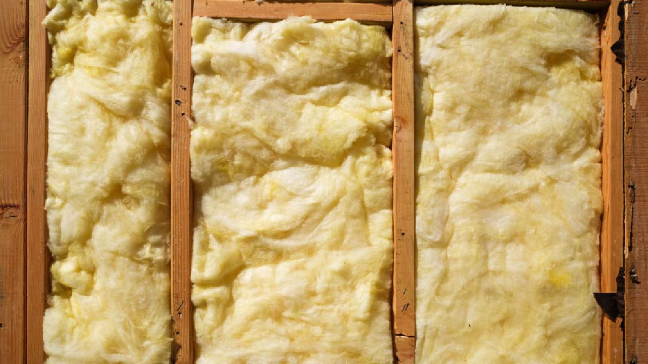 Glasswool, or fibreglass insulation, placed between timber frames